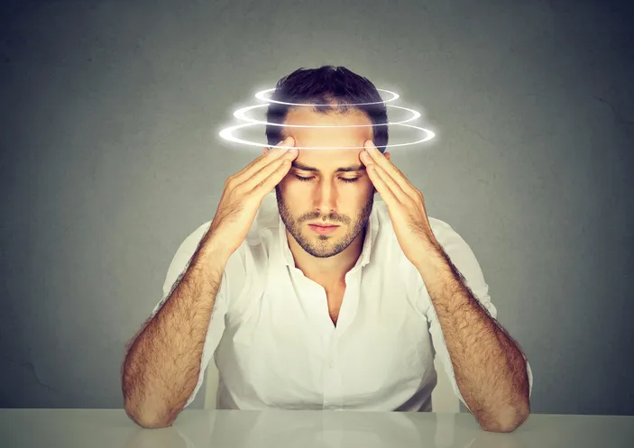 Man with vertigo. patient suffering from dizziness.